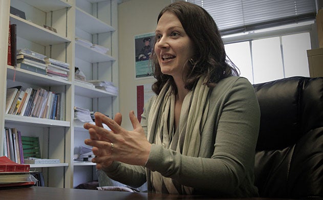 Erin Cline speaking in her office.