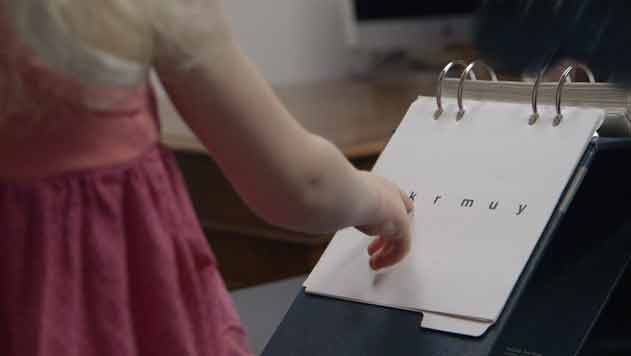 A female subject has her reading evaluated during a study.