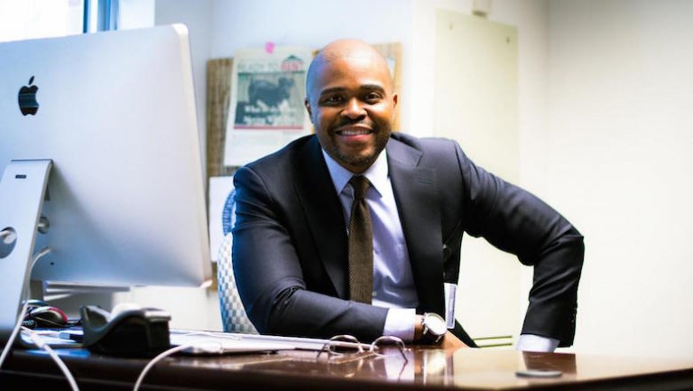 Christopher King sitting at his desk