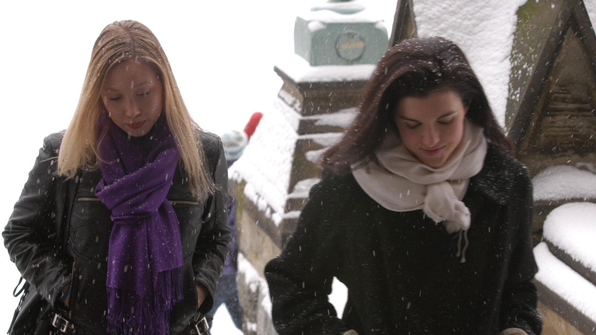 Students walk through the snow on campus