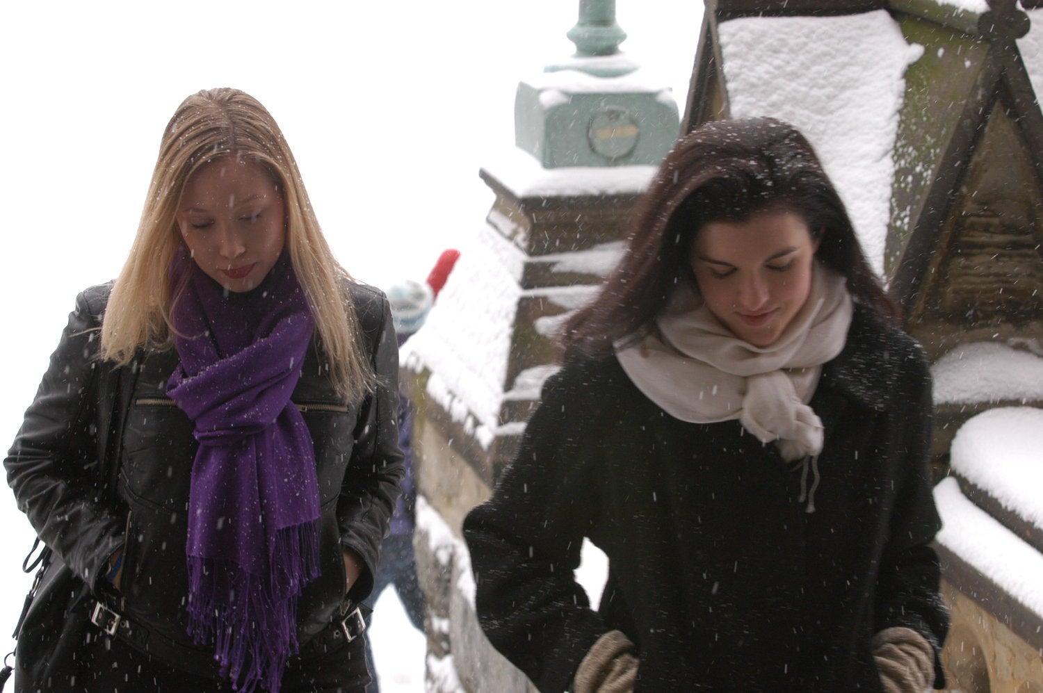 Students walk through the snow on campus