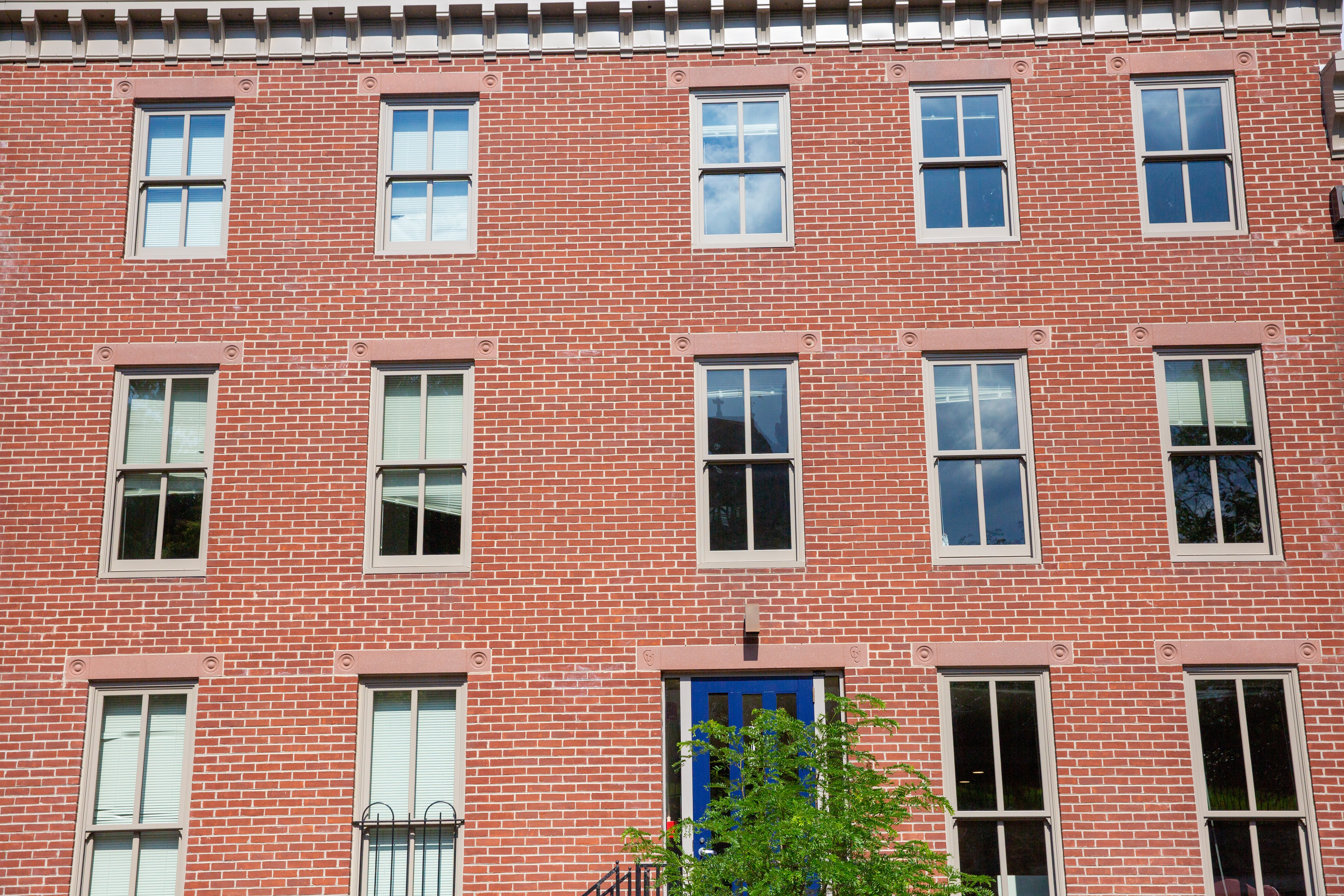 Photo displays a red bricked building.