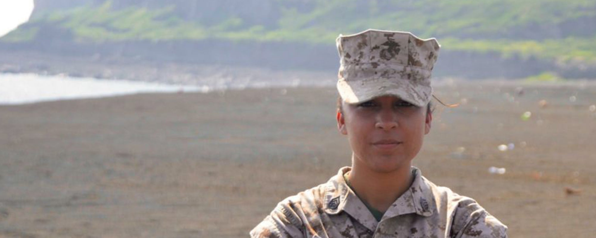 Jennifer Esparza wearing military fatigues in a desert area