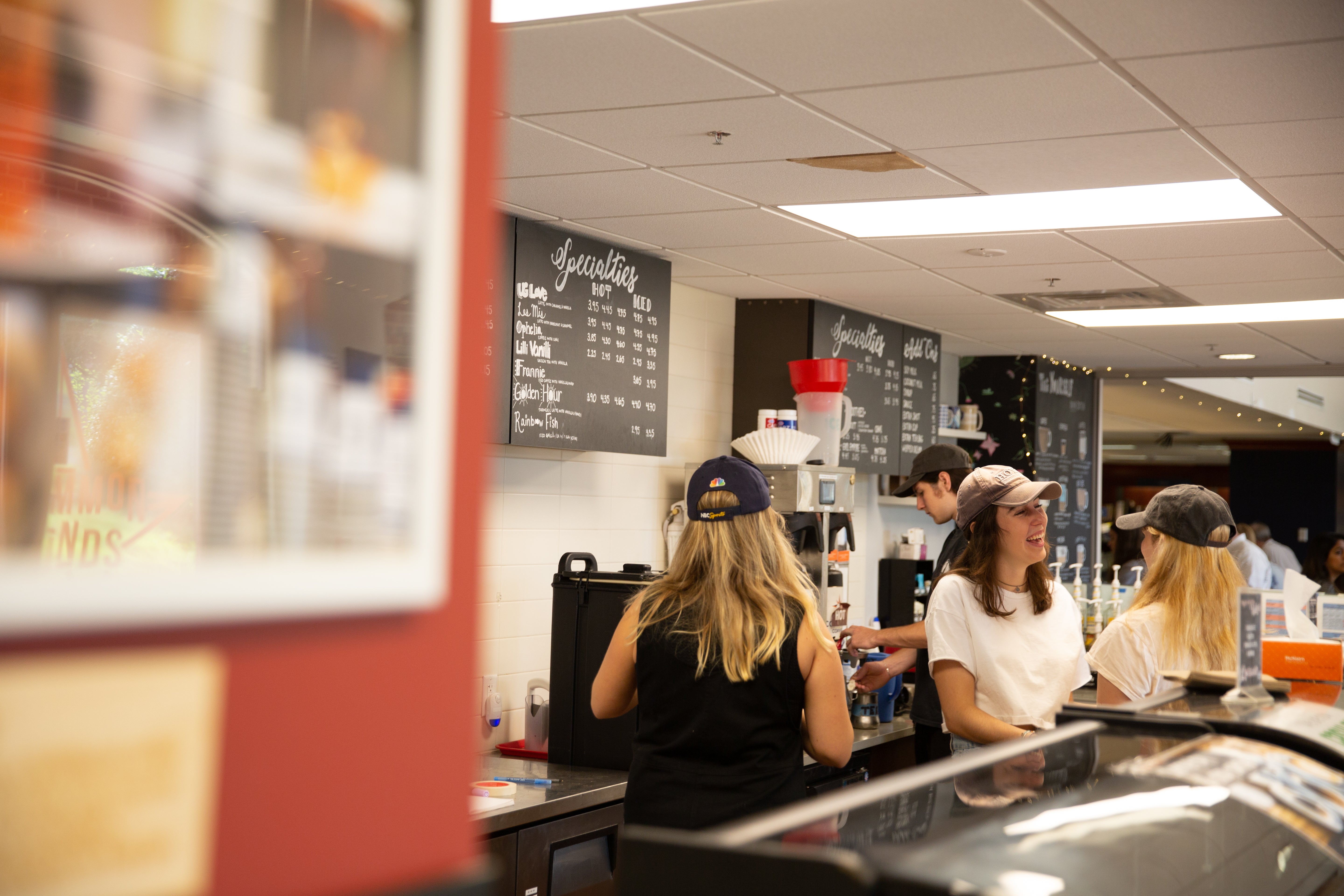 Students make coffee at a Corp-run coffee shop.