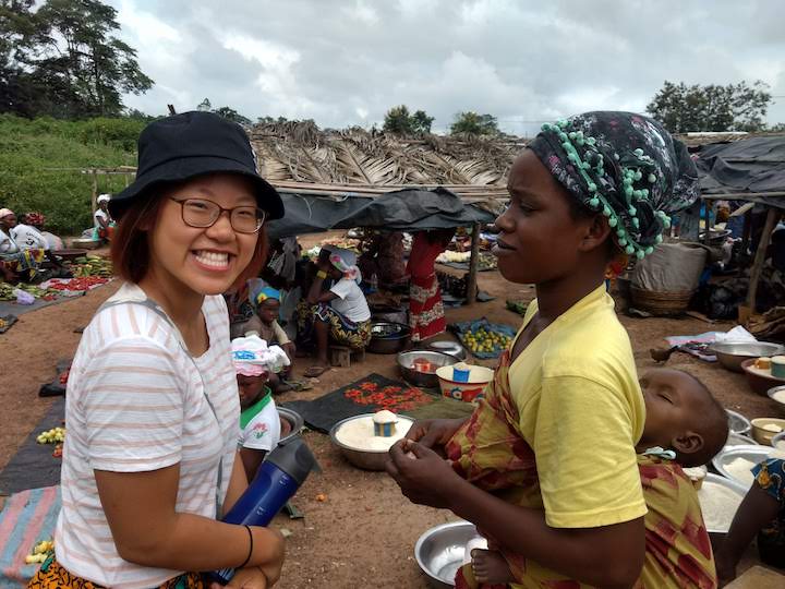 Student at market in Ivory Coast