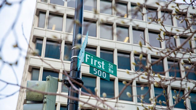 Photograph showing a building with the street sign reading First Street 500