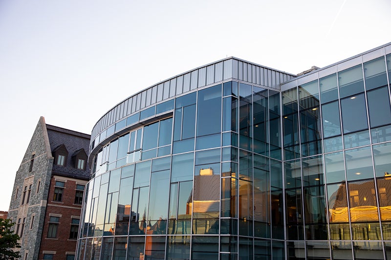 The sun setting in the reflecting windows of the McDonough School of Business