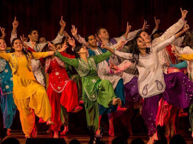 Students in costumes dancing