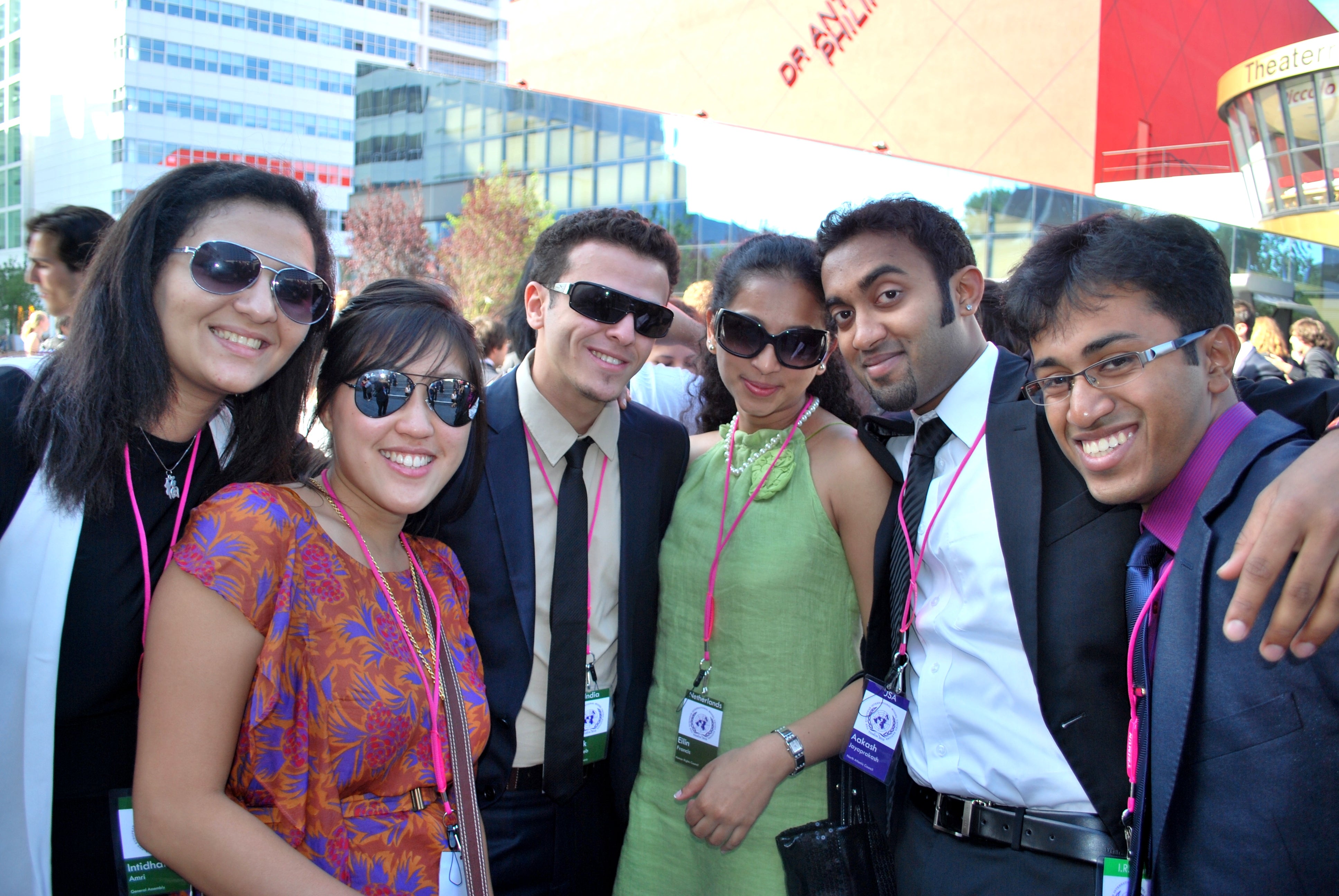 Georgetown international students standing close together in front of a building