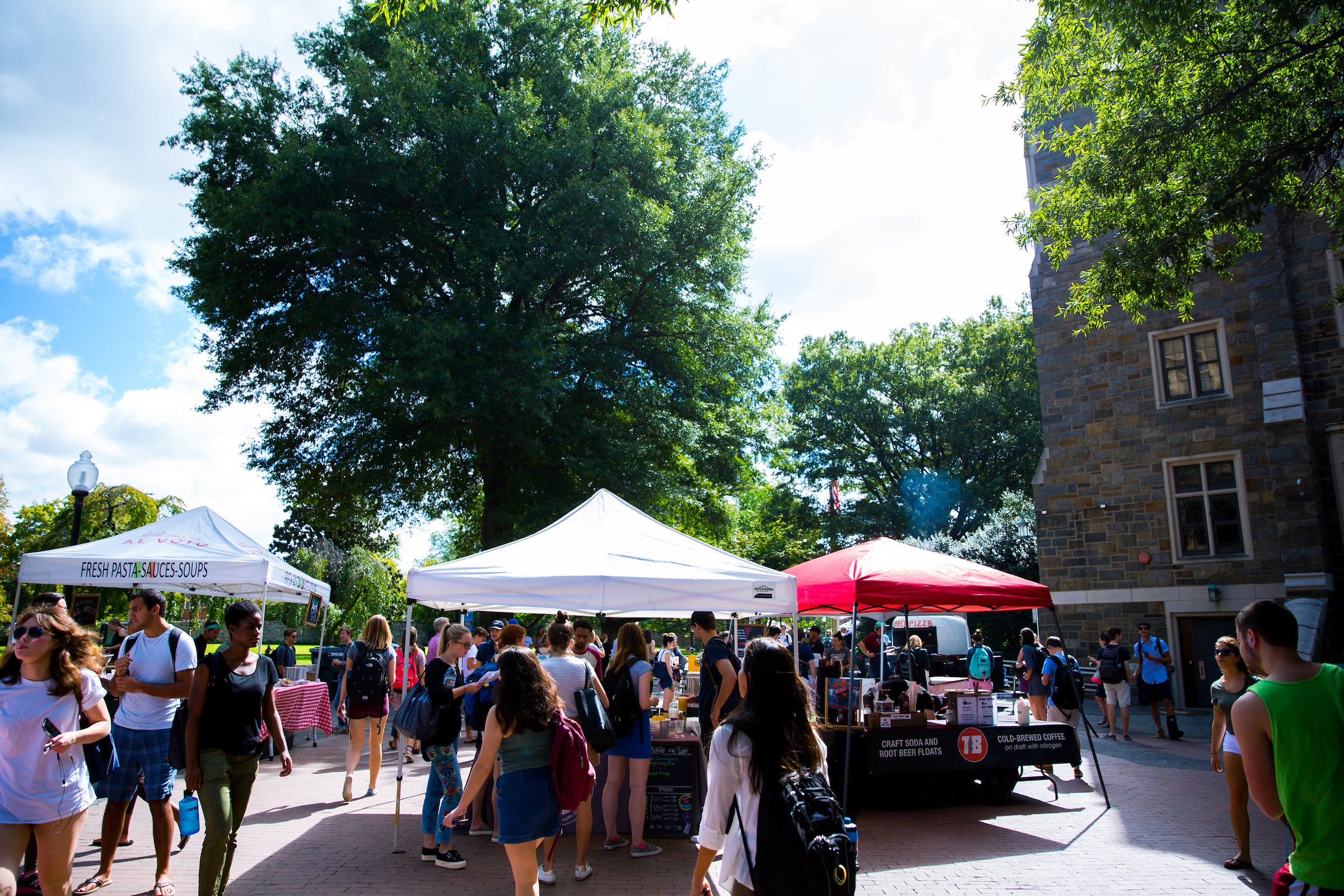 Local food vendors set up tents on campus to offer dishes to students during the weekly Farmer's Market.