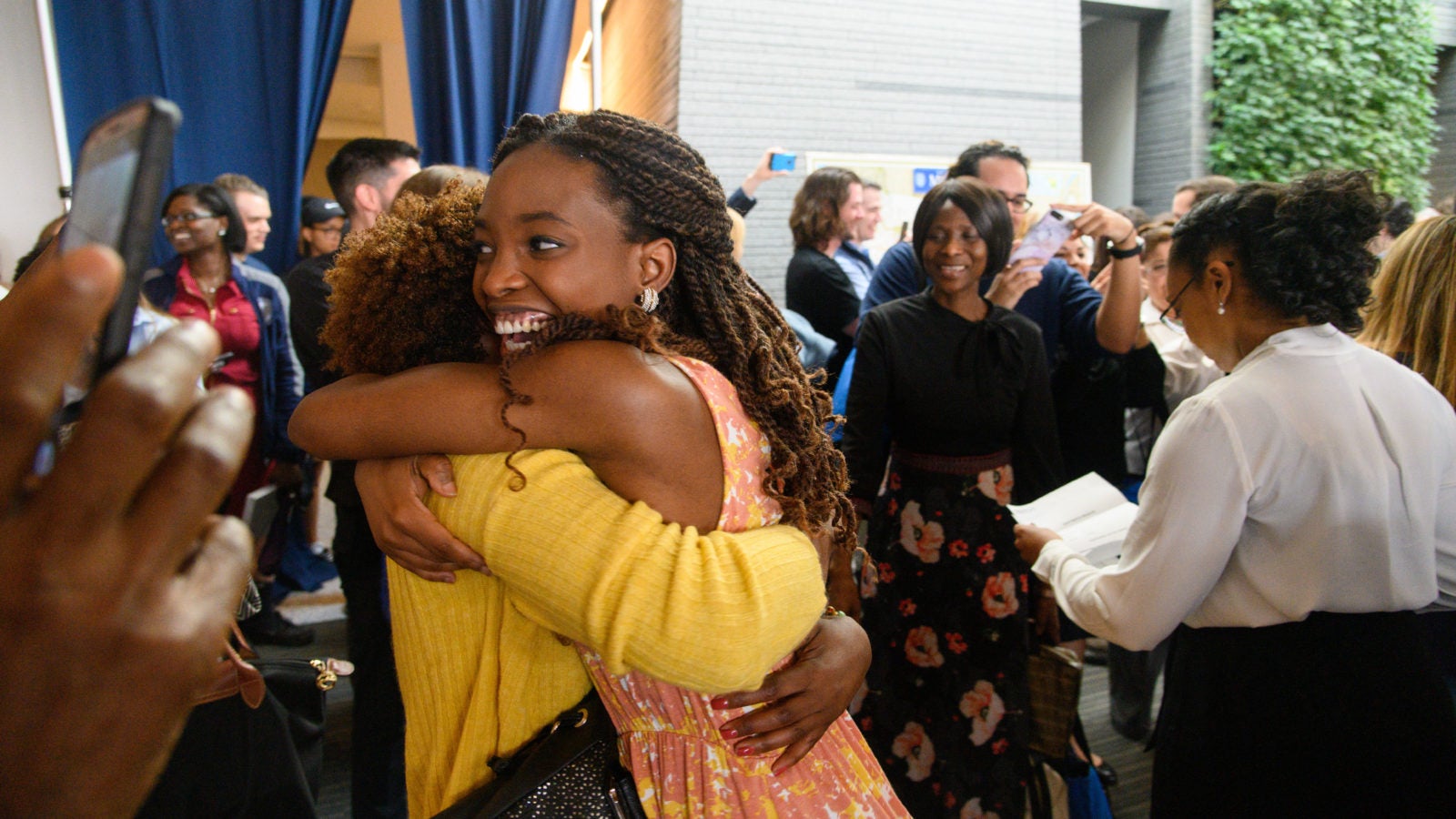 A School of Medicine student hugs her family on Match Day.