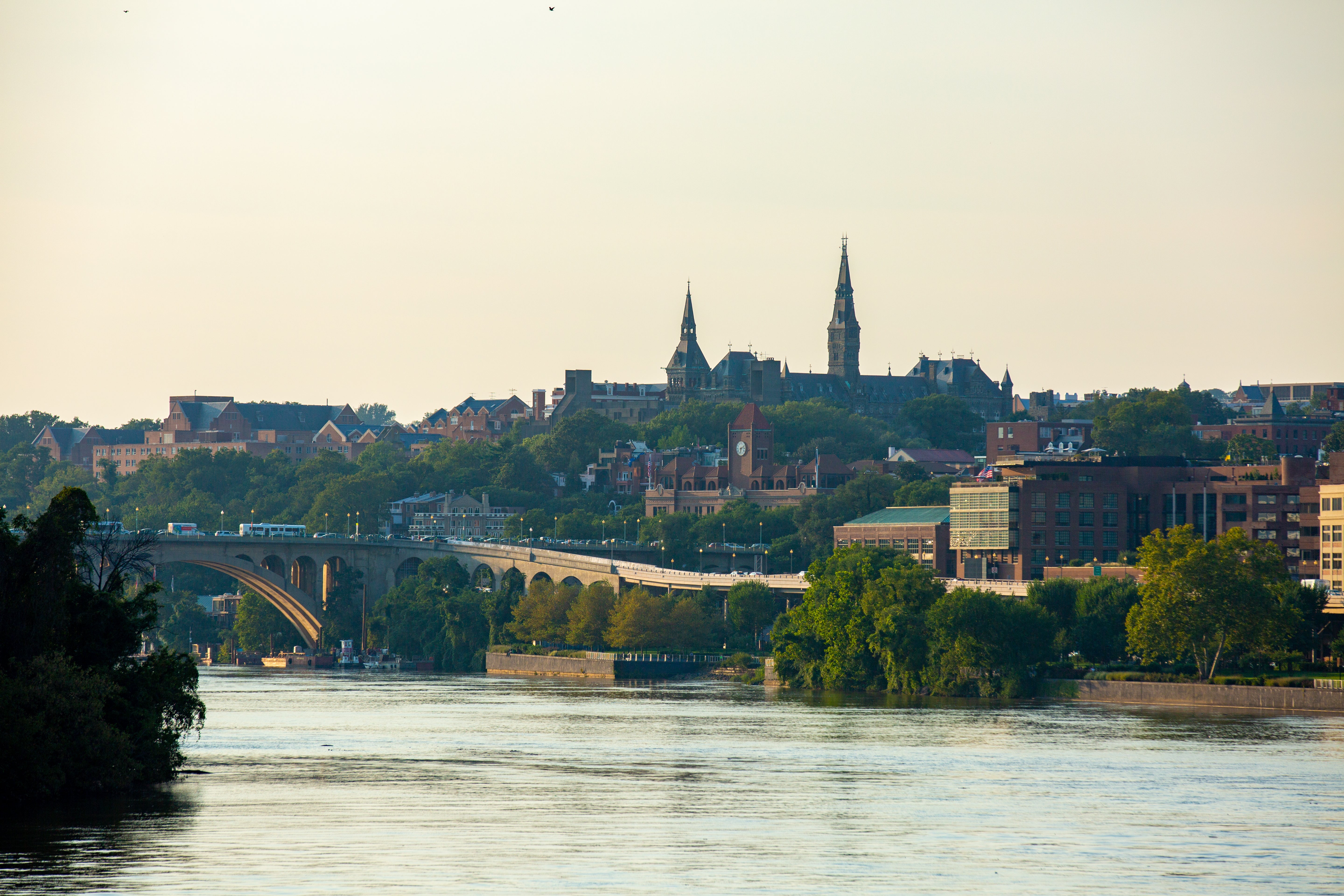 Georgetown is framed in the photo on the waterfront during sunset.