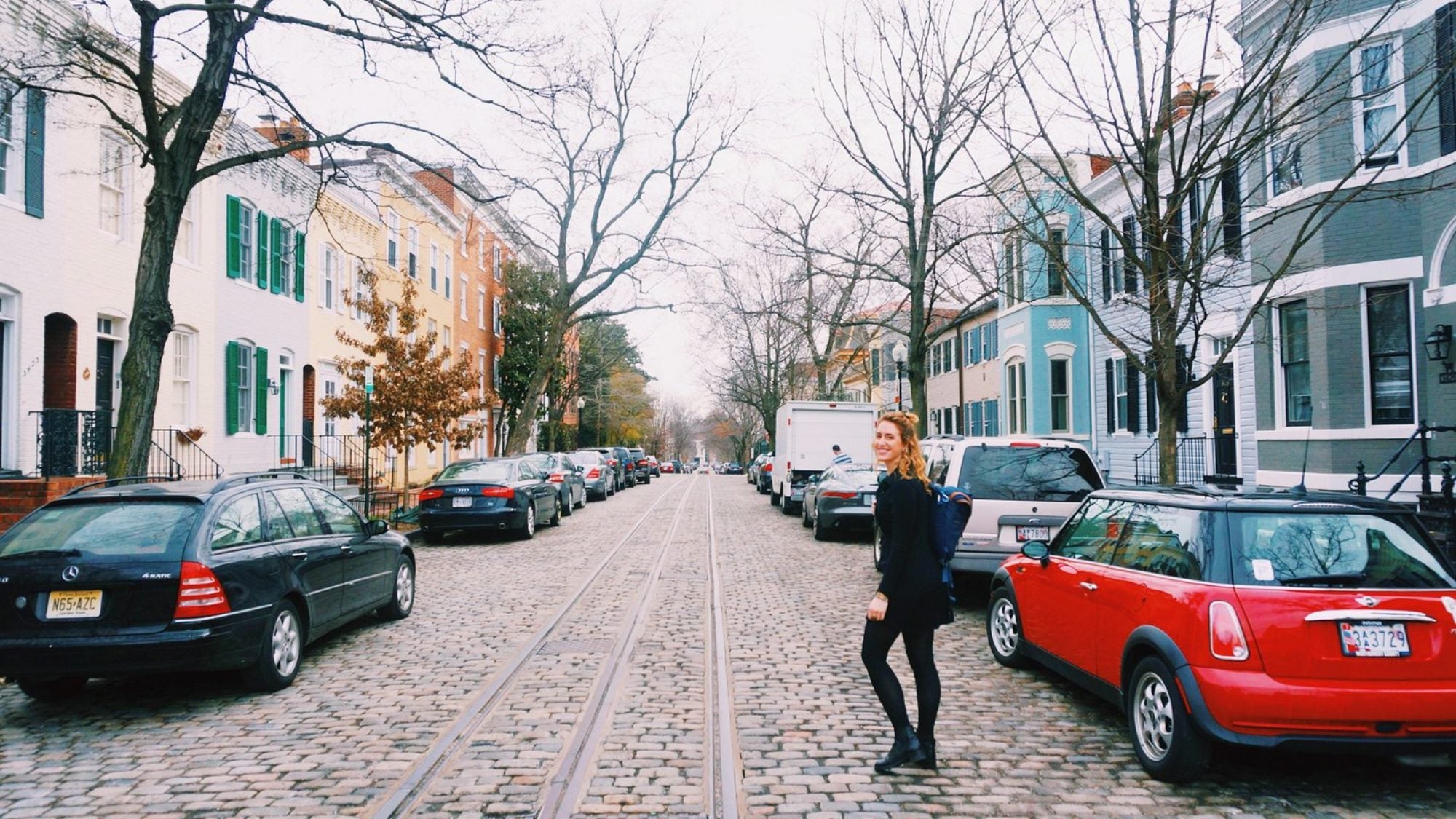 A student walks through the neighborhood