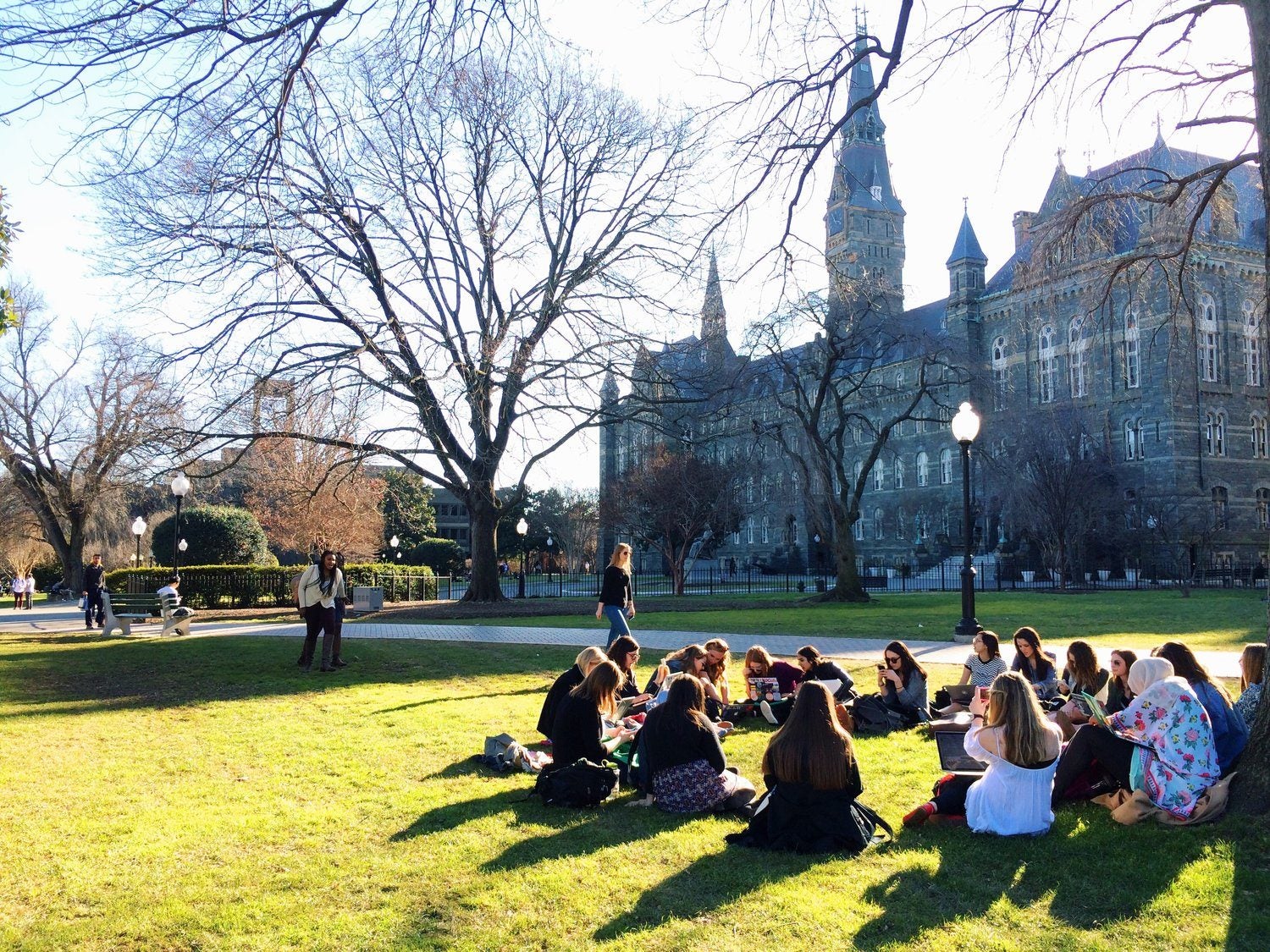 Students sit on Healy Lawn