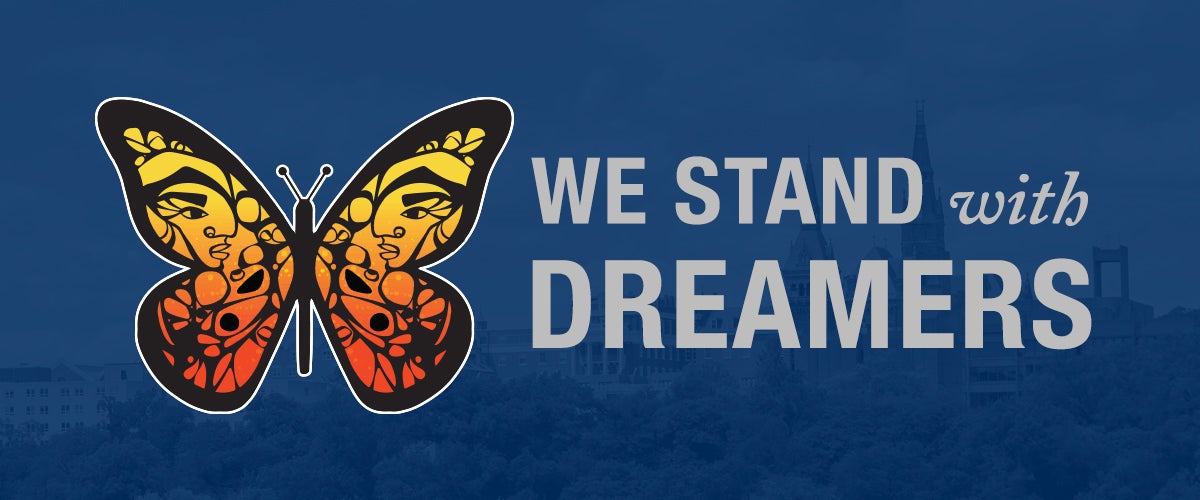 Graphic of a butterfly with Healy Building behind it and the words "We Stand With Dreamers."