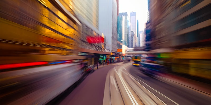 blurred image of road between skyscrapers