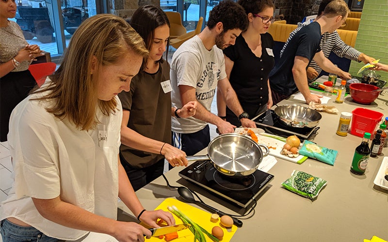 Students lined up at a cafeteria choosing food