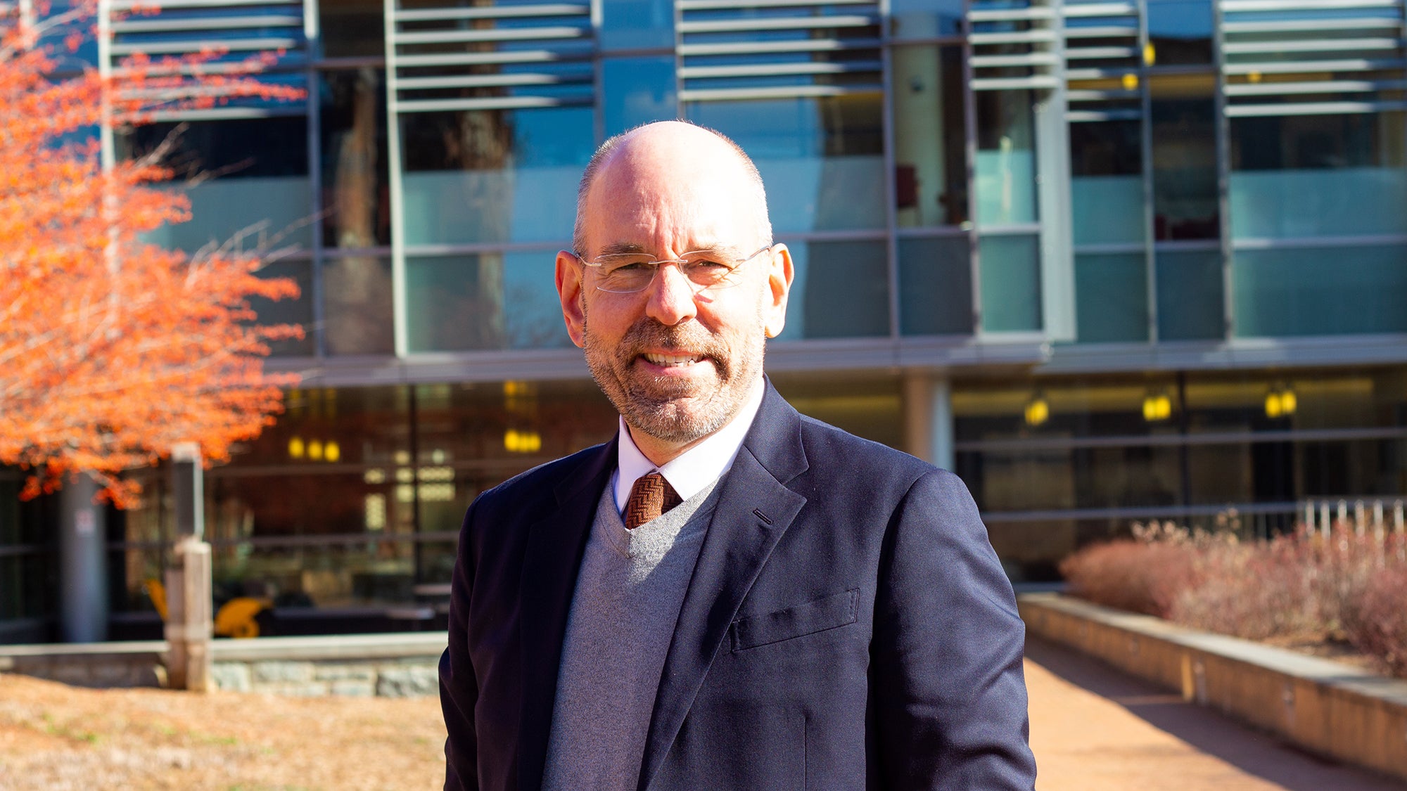 Uwe Brandes in front of a building