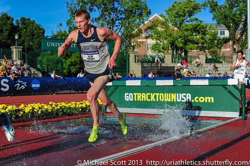 Dylan Sorensen runs on a track outside. Photograph by Michael Scott