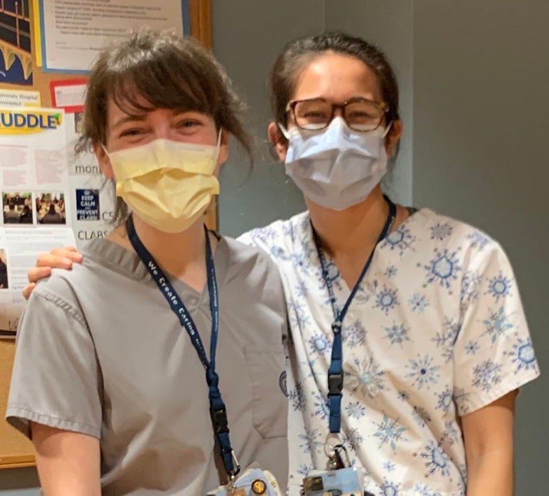 Catherine Zolbrod Freeman and Moira Redmond wearing masks and nursing outfits