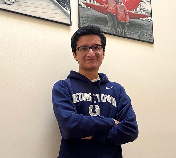 Aryaman Arora standing wearing a Georgetown sweatshirt