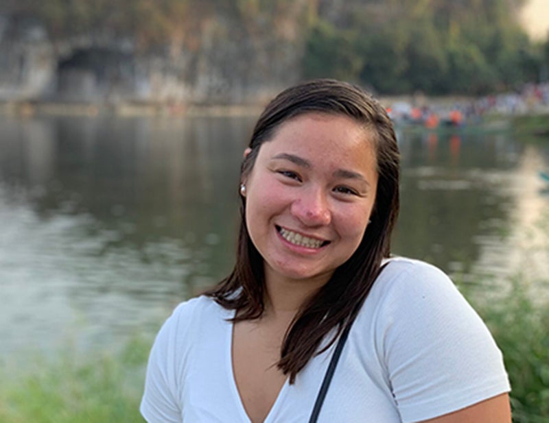 Cate Paterson outside in front of a lake