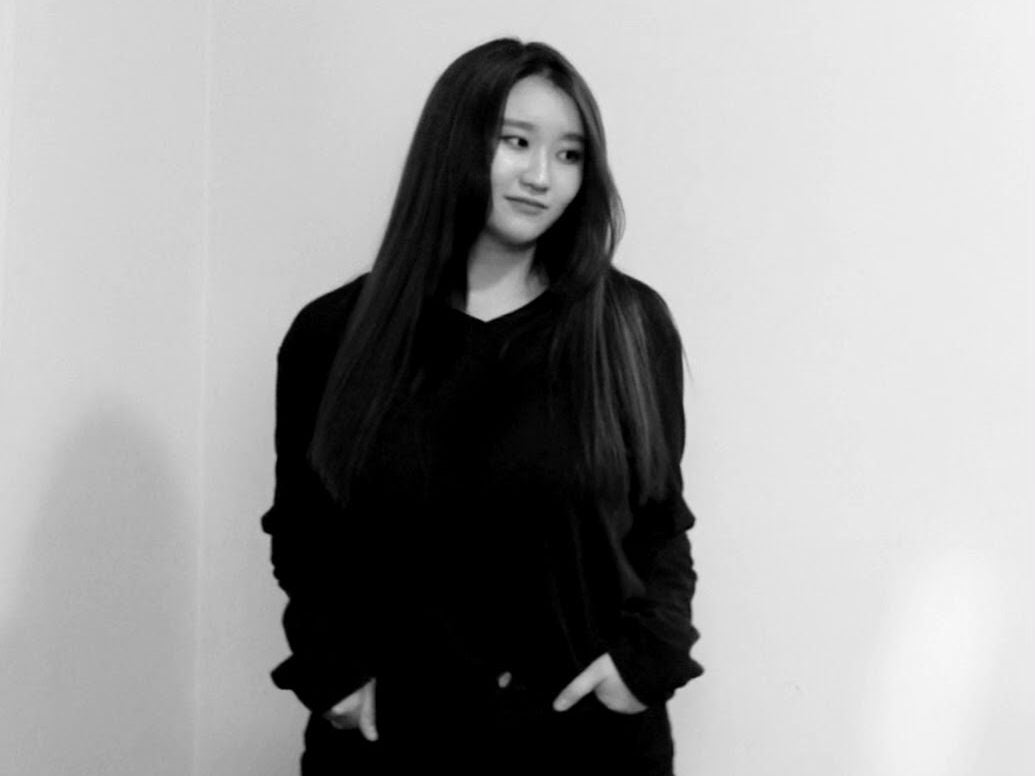 Black and white photo of Irene Chun with her hands in her pocket