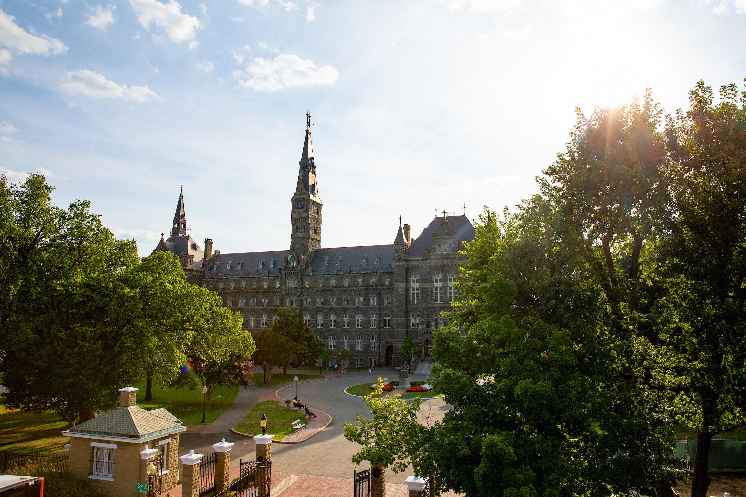 Sun shines on Healy Hall from a distance