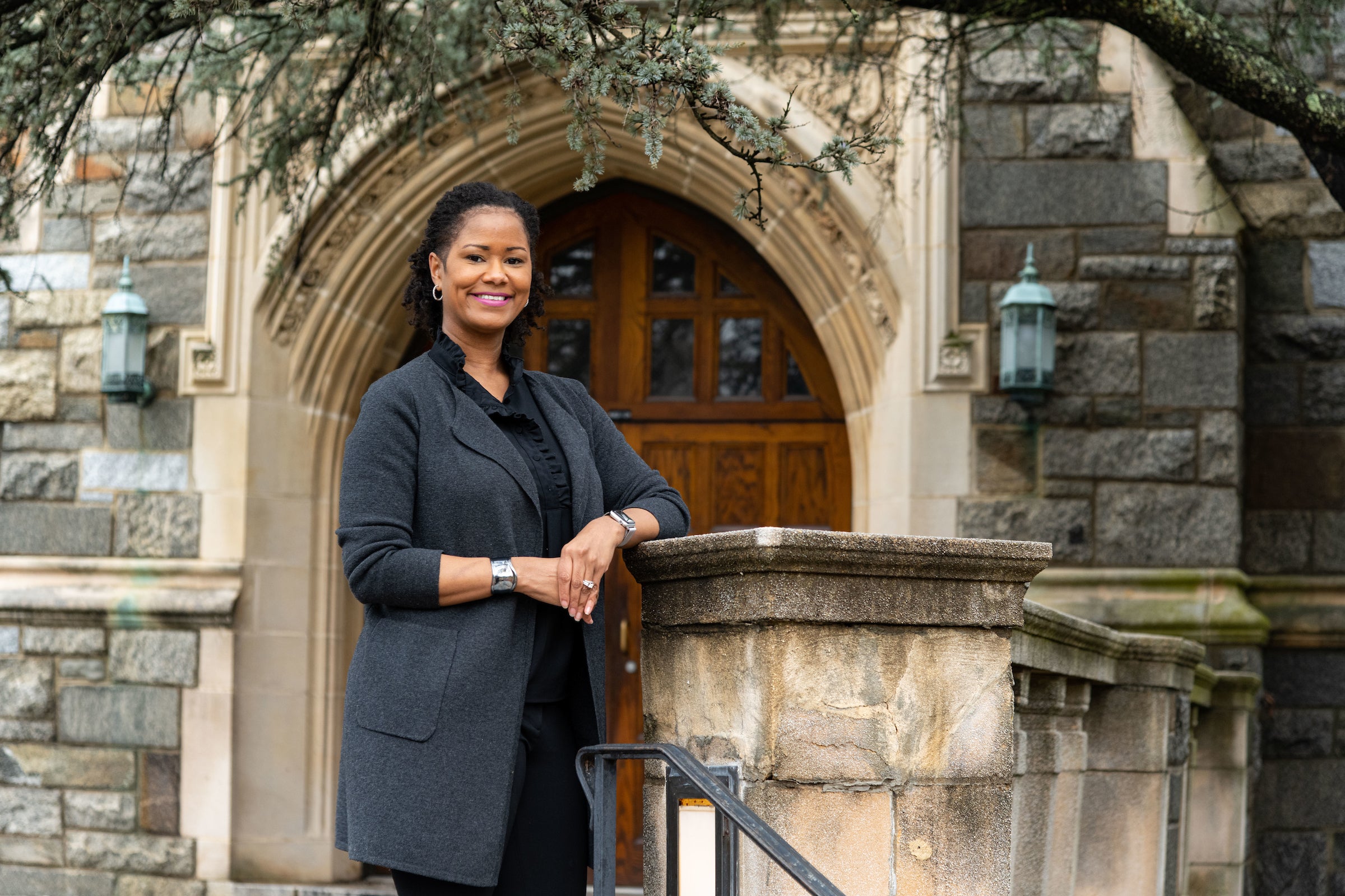 Soyica Diggs Colbert stands in front of a stone building