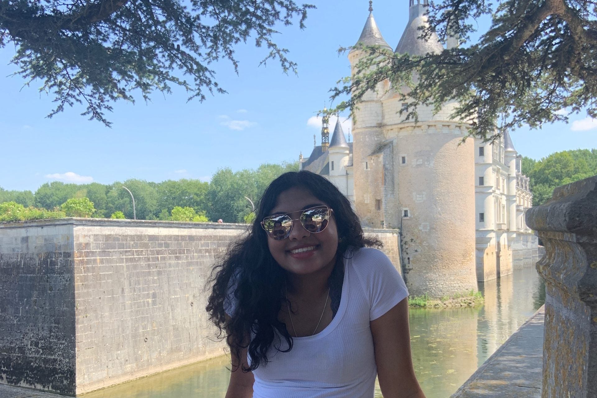 Varsha Menon in front of a castle in France