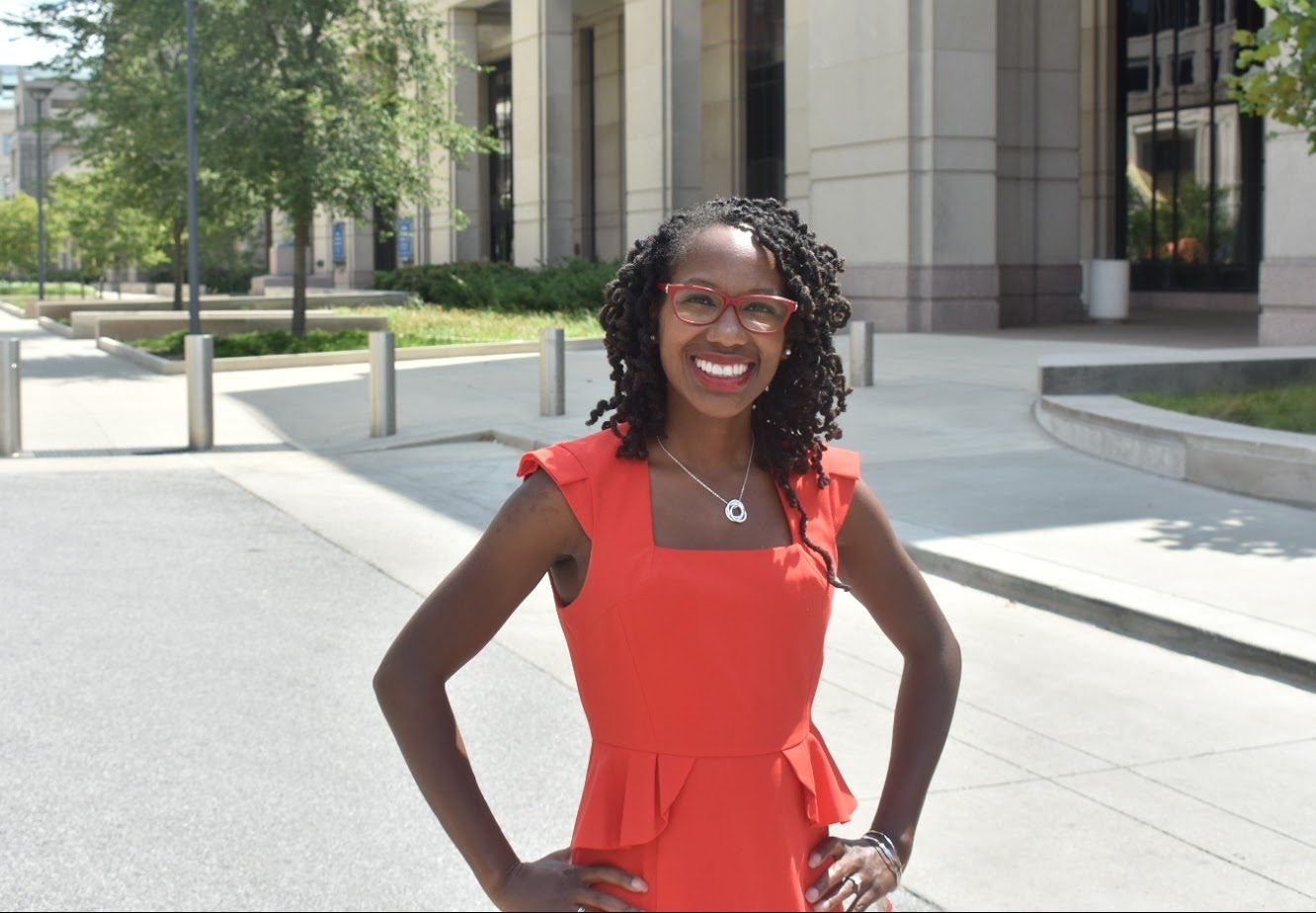 Nadia Brown stands outside