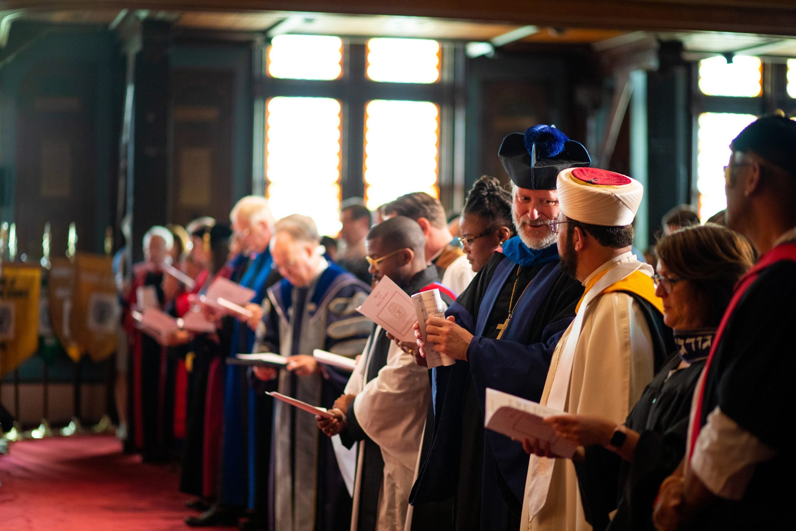 Chaplains in religious garments from different traditions interacting