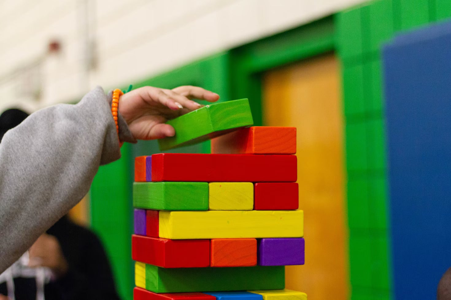 A picture of a child playing with blocks.