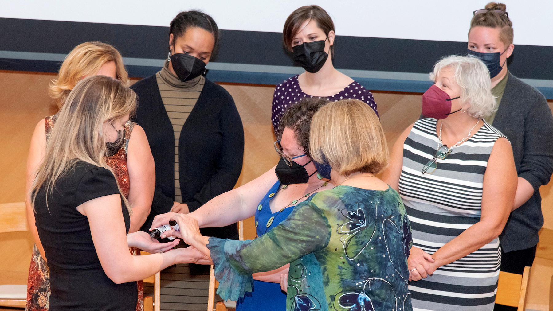 Students received a blessing of the hands at the School of Nursing & Health Studies