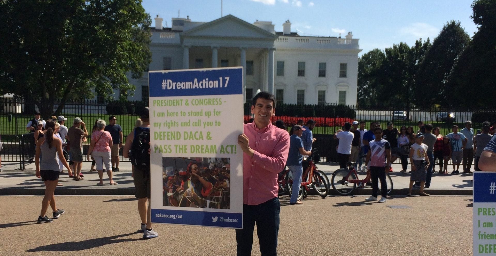 Abel Cruz Flores Holds a Dream Act sign in front of the White House