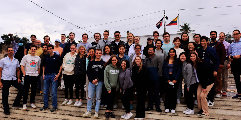 A large group of students from the Bachelor of Science in Business and Global Affairs program pose together during an immersion trip in the Dominican Republic.