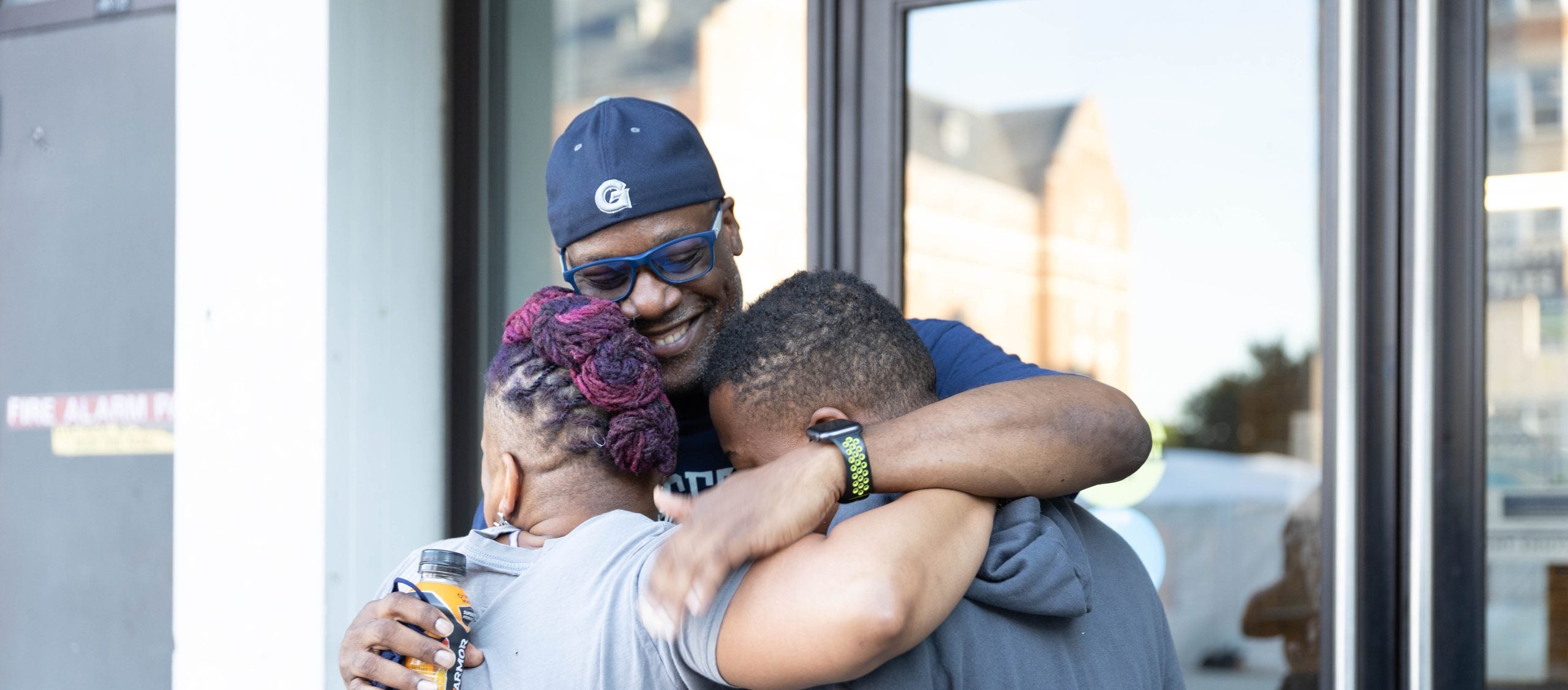 A family embraces during move-in weekend