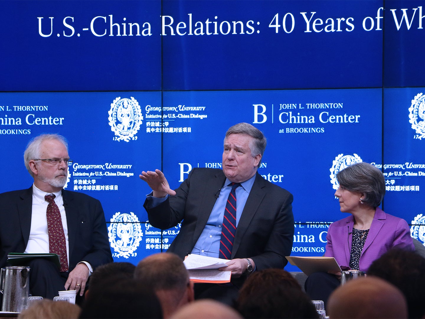 Professor Dennis Wilder, a former CIA China analyst, speaks on stage at an event.