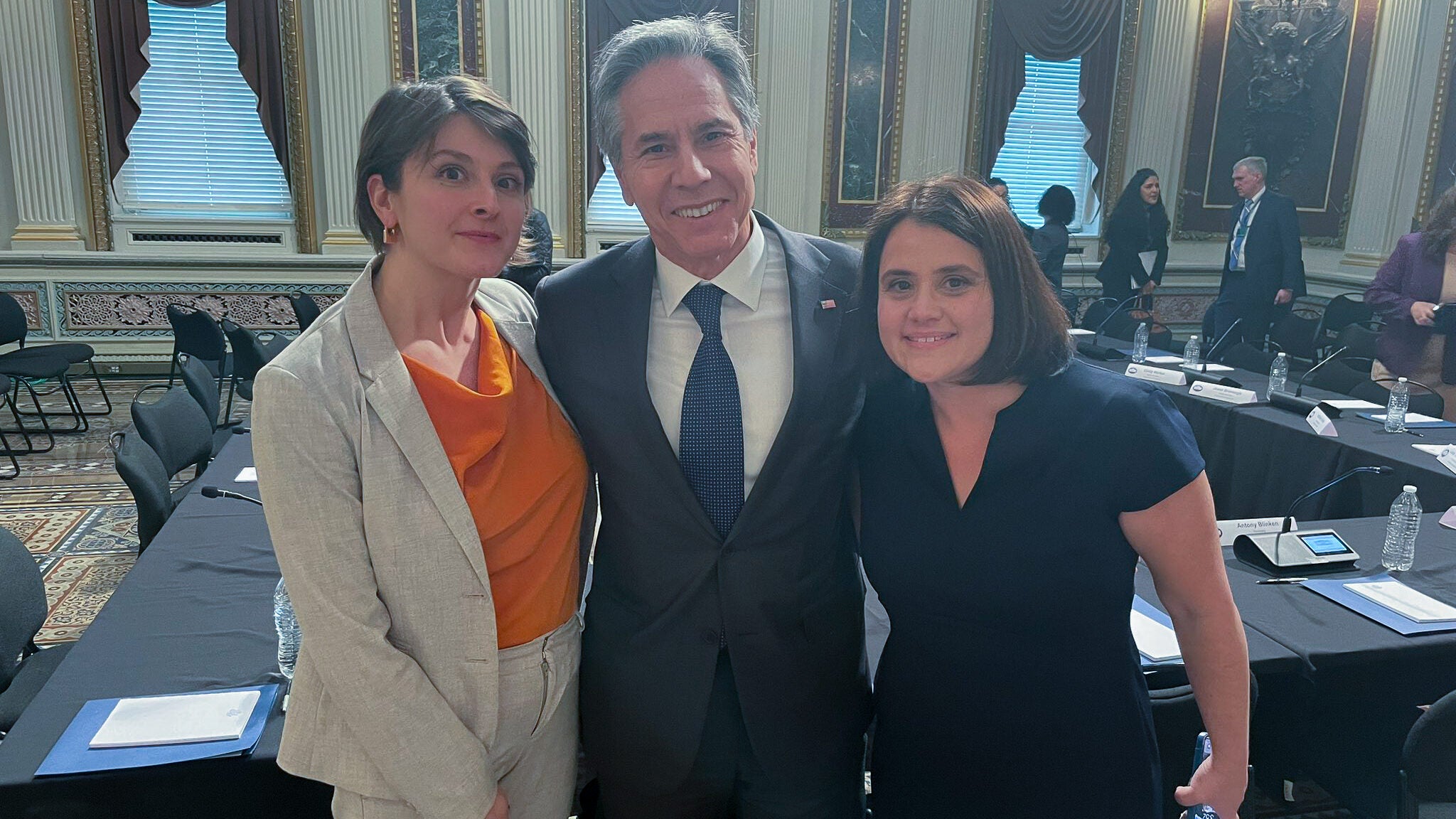 From left to right: Cori Alonso Yoder (C'04), Secretary of State Antony Blinken, and Rachel Micah-Jones (C'00).