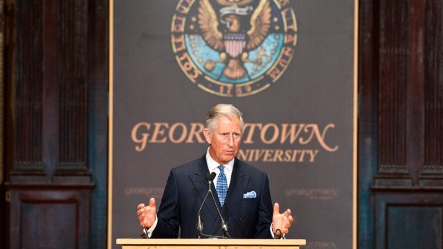 King Charles stands at a podium to deliver remarks at an event in Gaston Hall.