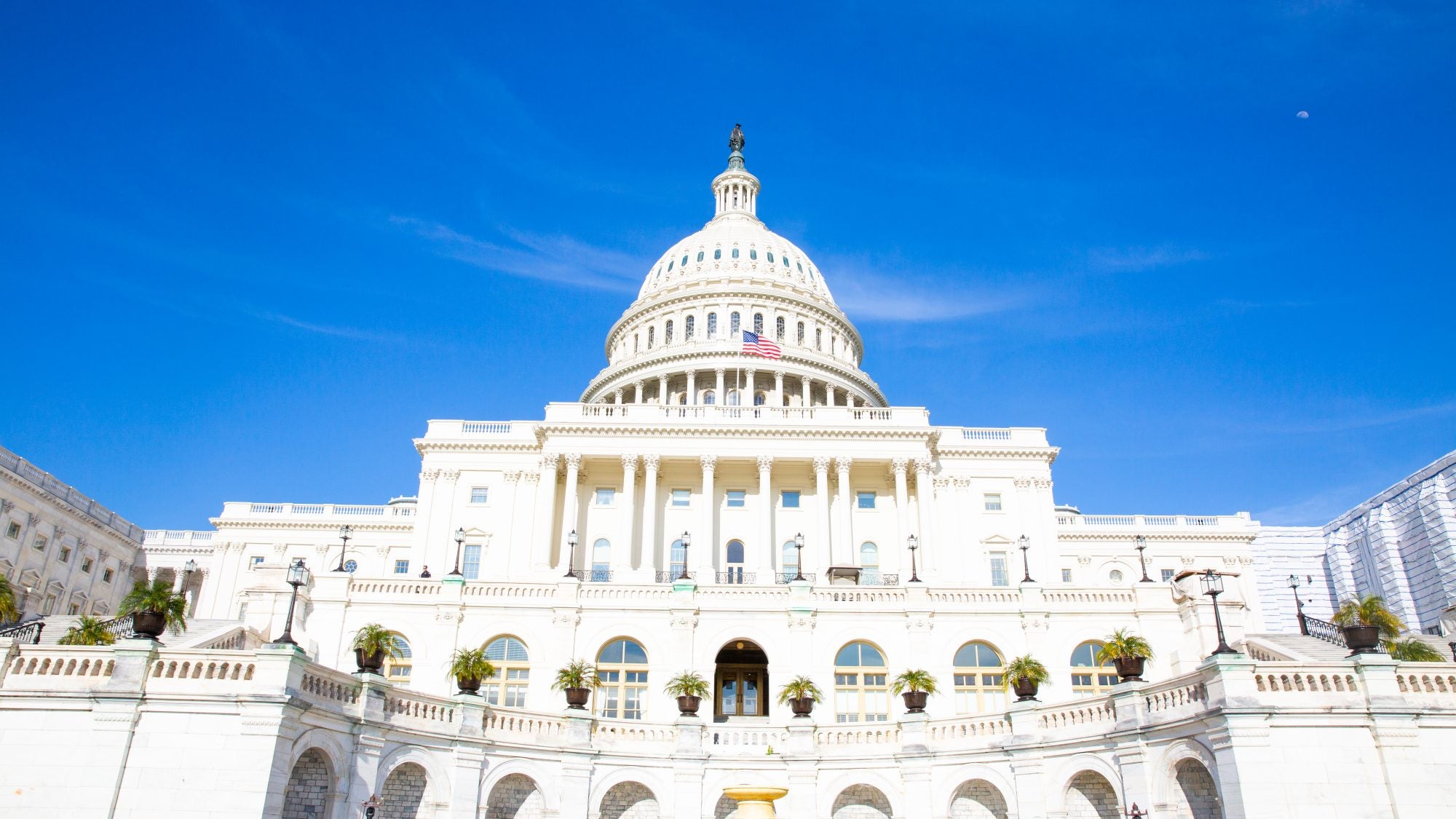 A photo of the U.S. Capitol with a blue sky.