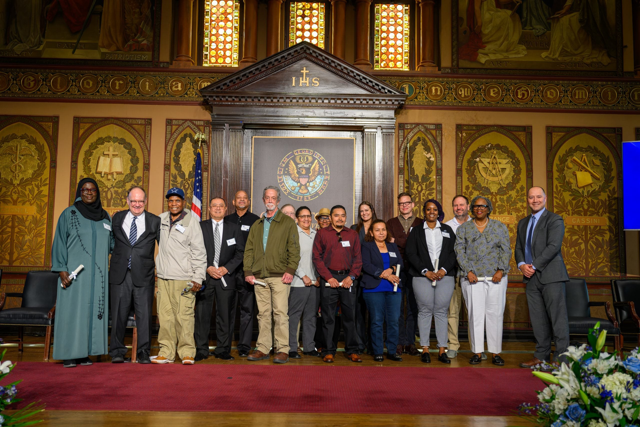 President John J. DeGioia stands with the honorees at the Service Awards Ceremony.