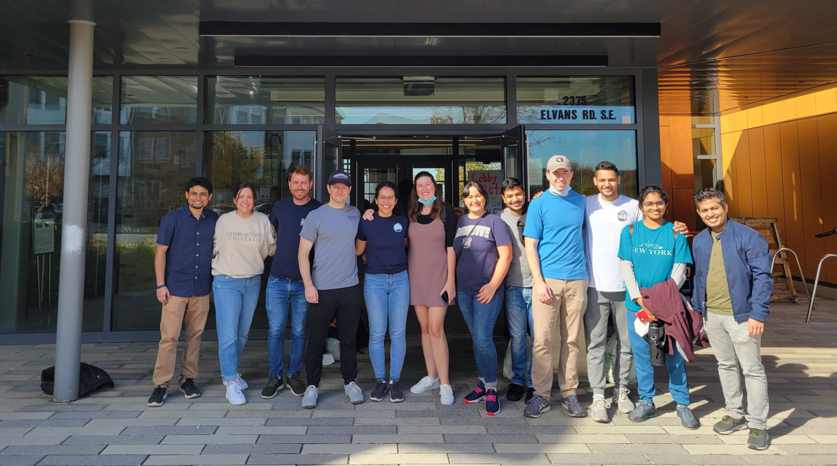 A group of Flex MBA students smile and stand side by side.