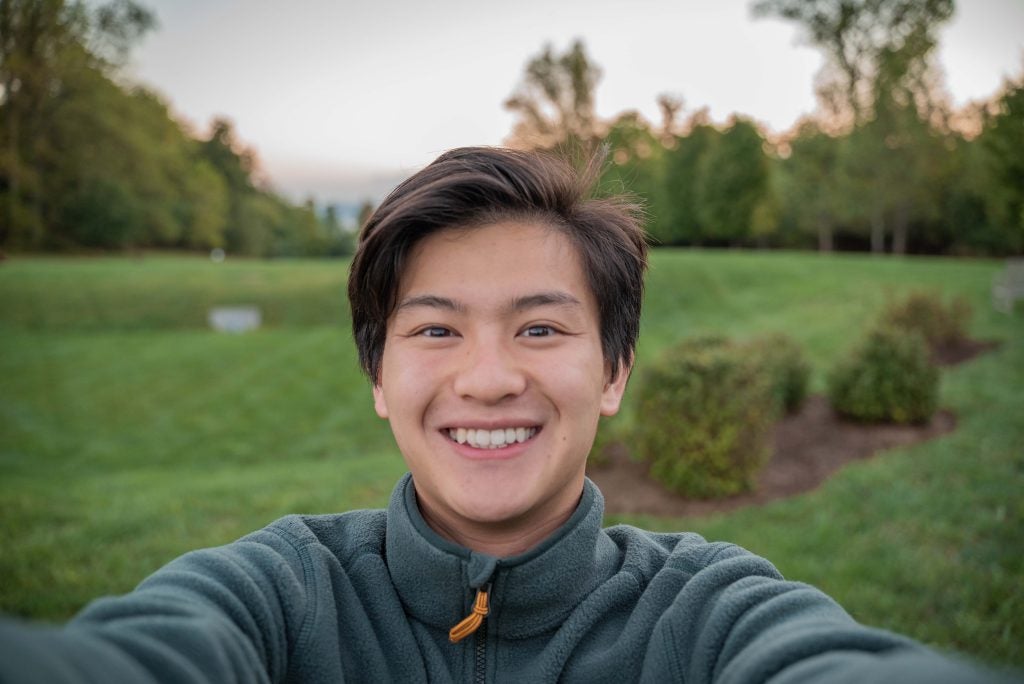 Bennie takes a selfie with the blue ridge mountains behind him