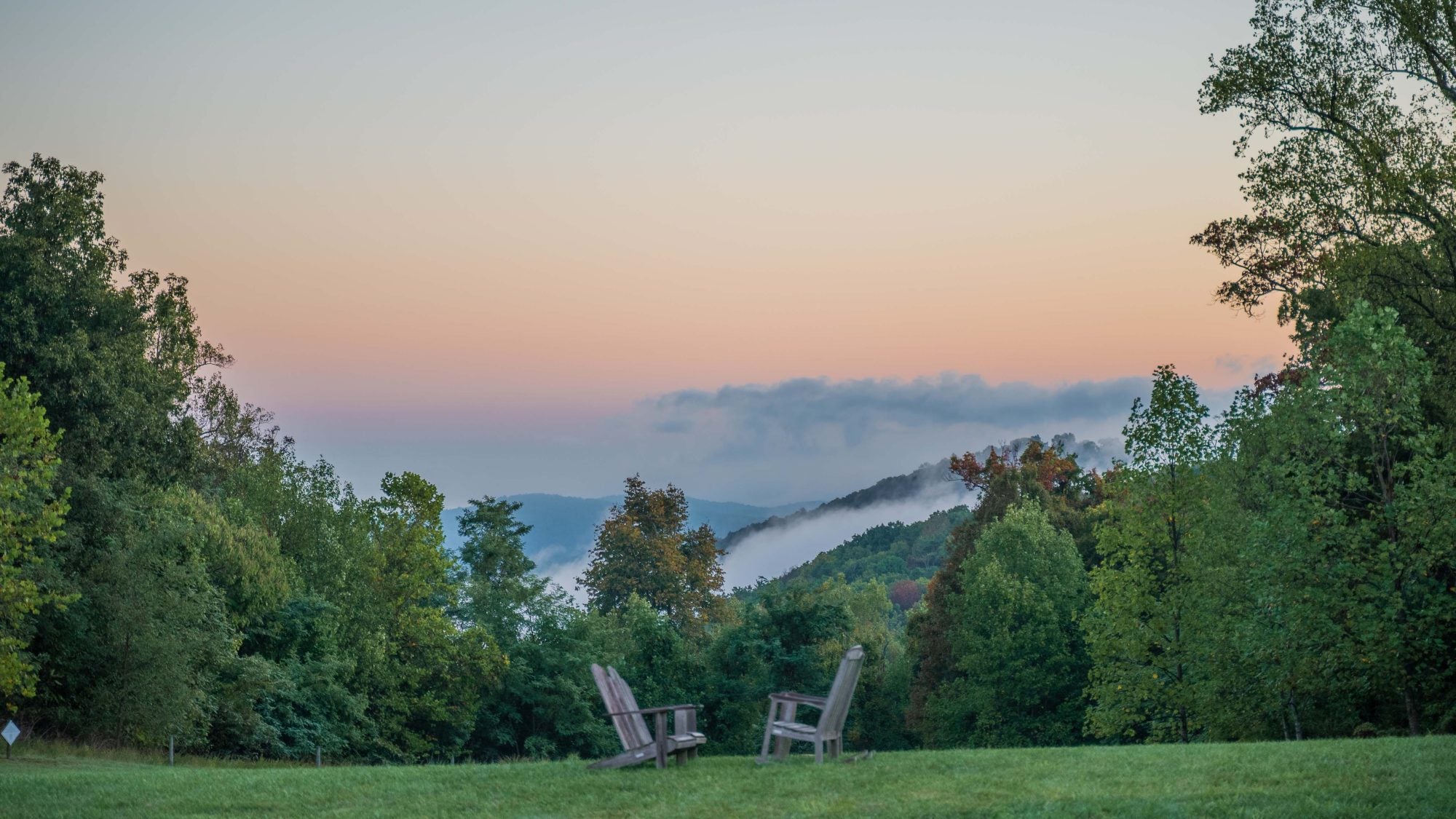 a foggy sunrise on the hills of the Blue Ridge Mountains