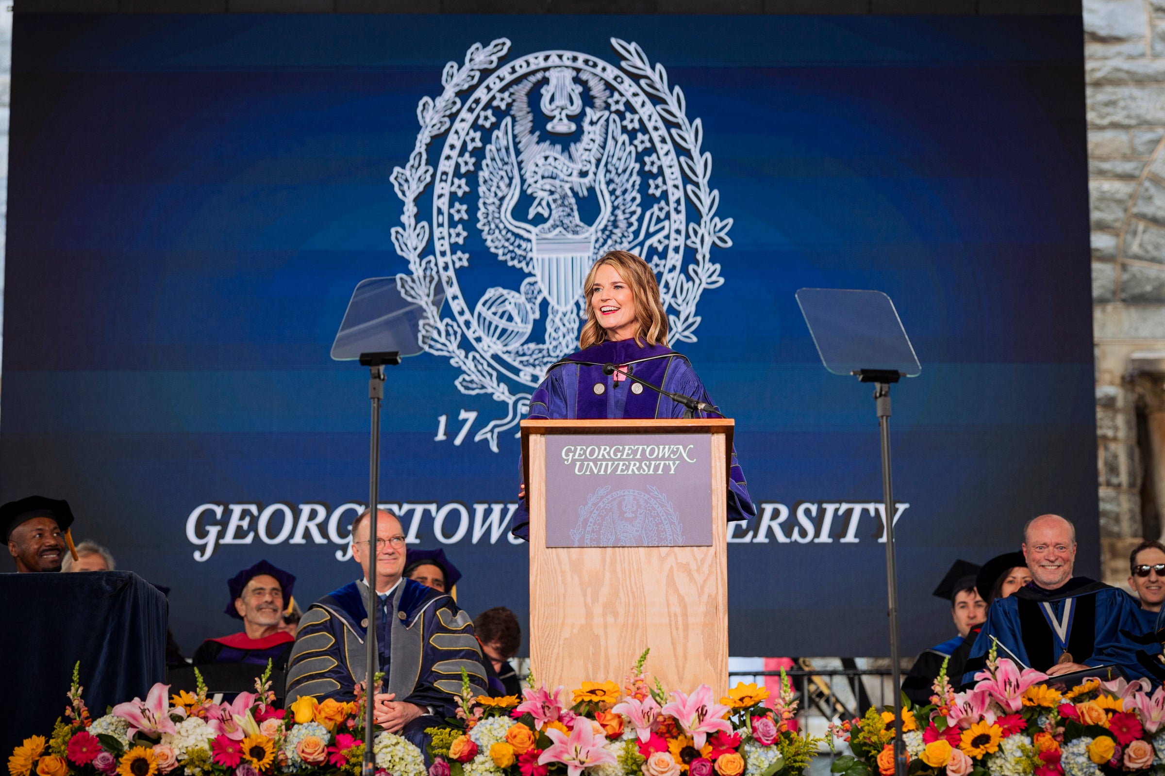 Georgetown Law's 2023 commencement speaker, Savannah Guthrie, speaks on stage.