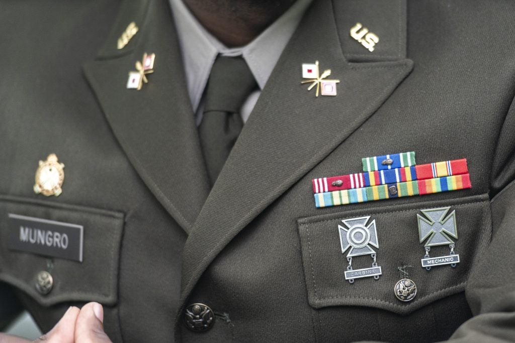 A close up shot of Lester Mungro's Army dress uniform with medals and ribbons