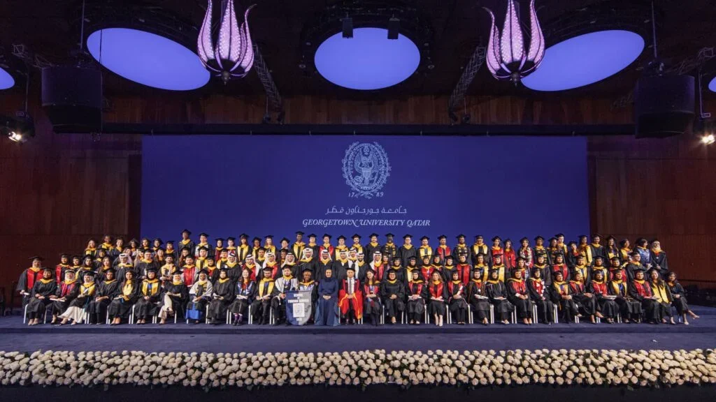 A group shot of the graduates from Georgetown University in Qatar's Class of 2024