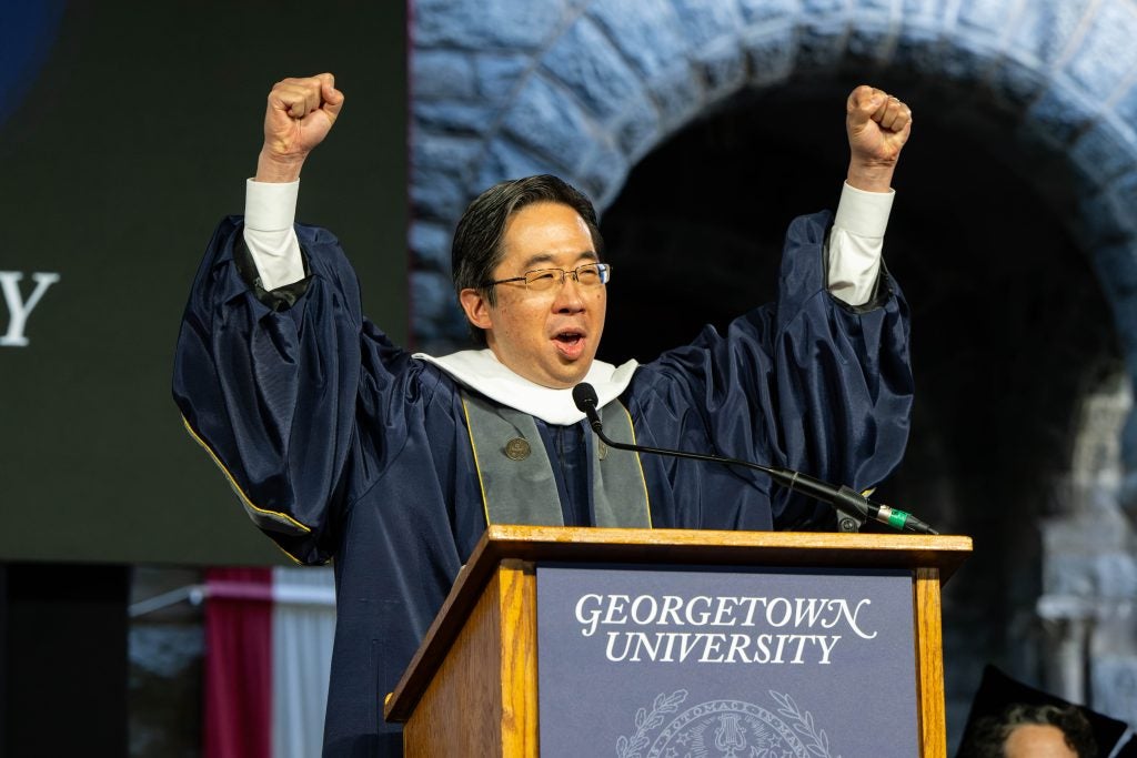 Todd Park pumping his arms in the air celebrating graduates