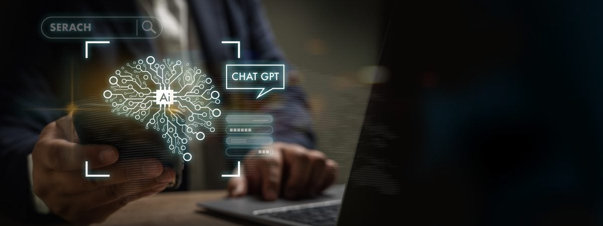 Man typing on computer with a Chat GPT graphic overlay